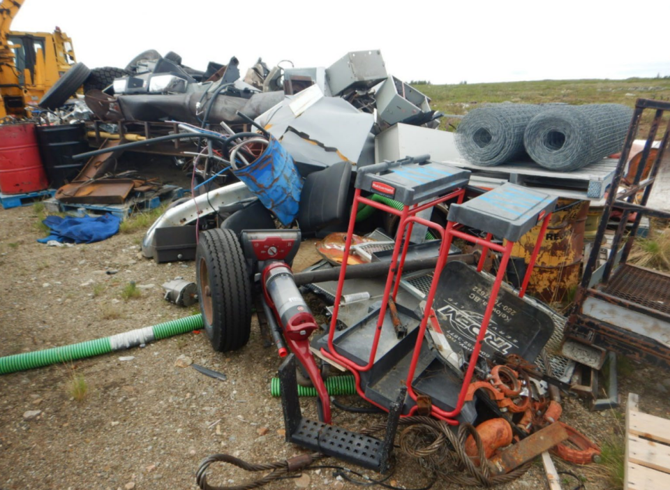 A GNWT inspector's photo shows accumulated scrap material at the Margaret Lake camp.
